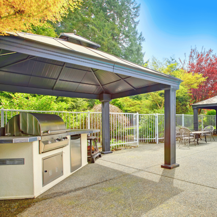 Covered patio with outdoor kitchen and grill