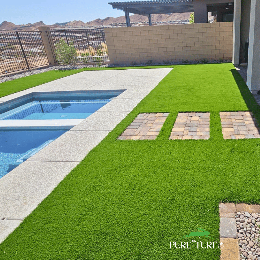 Pool deck with stepping stones through artificial turf