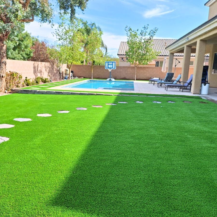 Pool area with stepping stones in artificial turf
